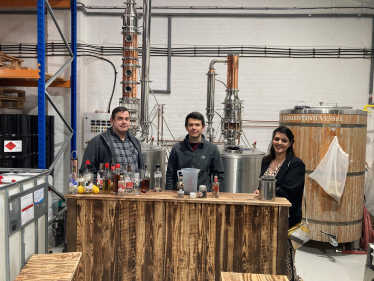 Picture shows Natasha Asghar MS with Spirit of Wales Chief Executive, Daniel Dyer, and Head Distiller, James Gibbons