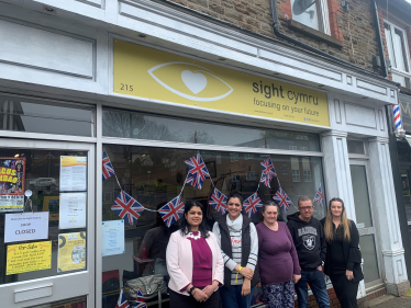 Natasha Asghar MS outside Sight Cymru's first charity shop.